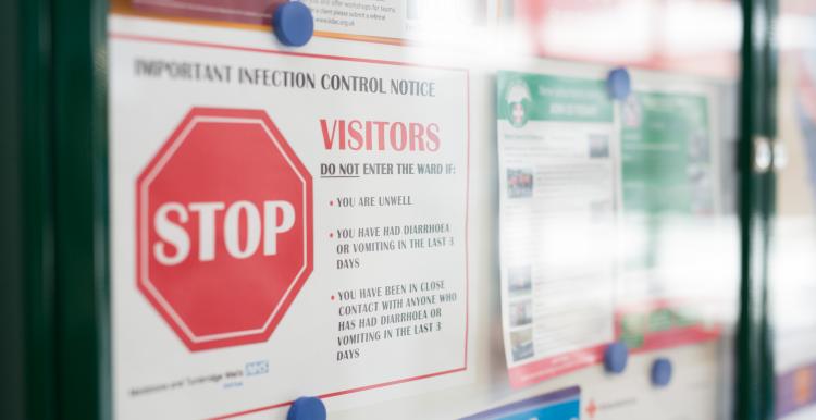 GP access following the pandemic Image of a noticeboard in a health service, with a sign warning about infection control