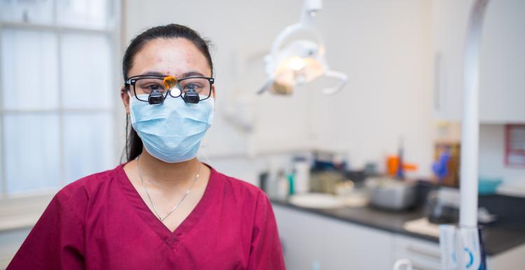dentist with mask in clinic PPE