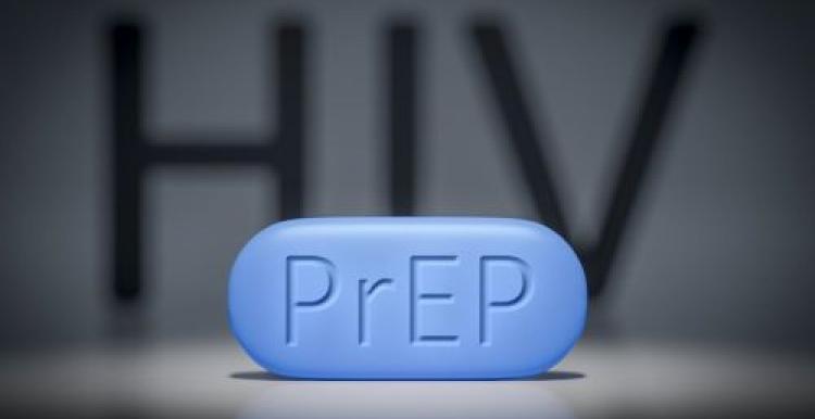 HIV, PrEP large blue pill with PrEP written on it, HIV written and blurred at the back