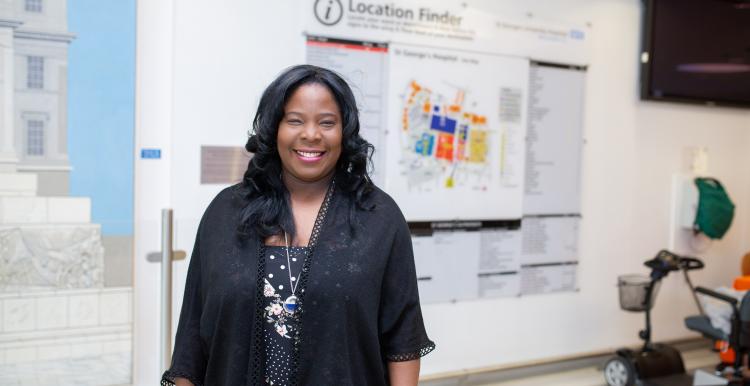 Diabetes Woman in hospital standing in front of map sign