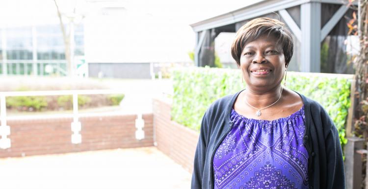 Carers Woman standing in front of building
