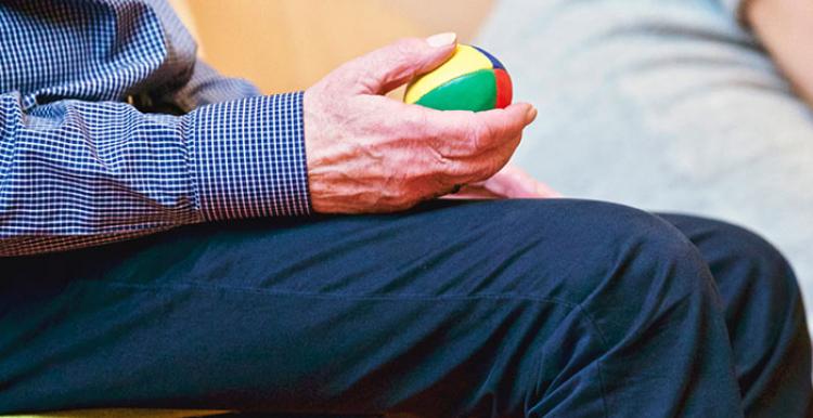 Close up of man holding ball