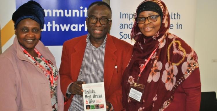 three faith group leaders in front of community southwark banner