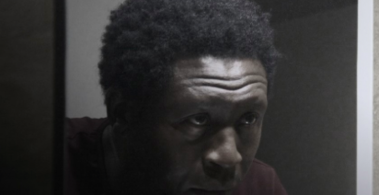Poster of Orchid film - Black man looking in the mirror