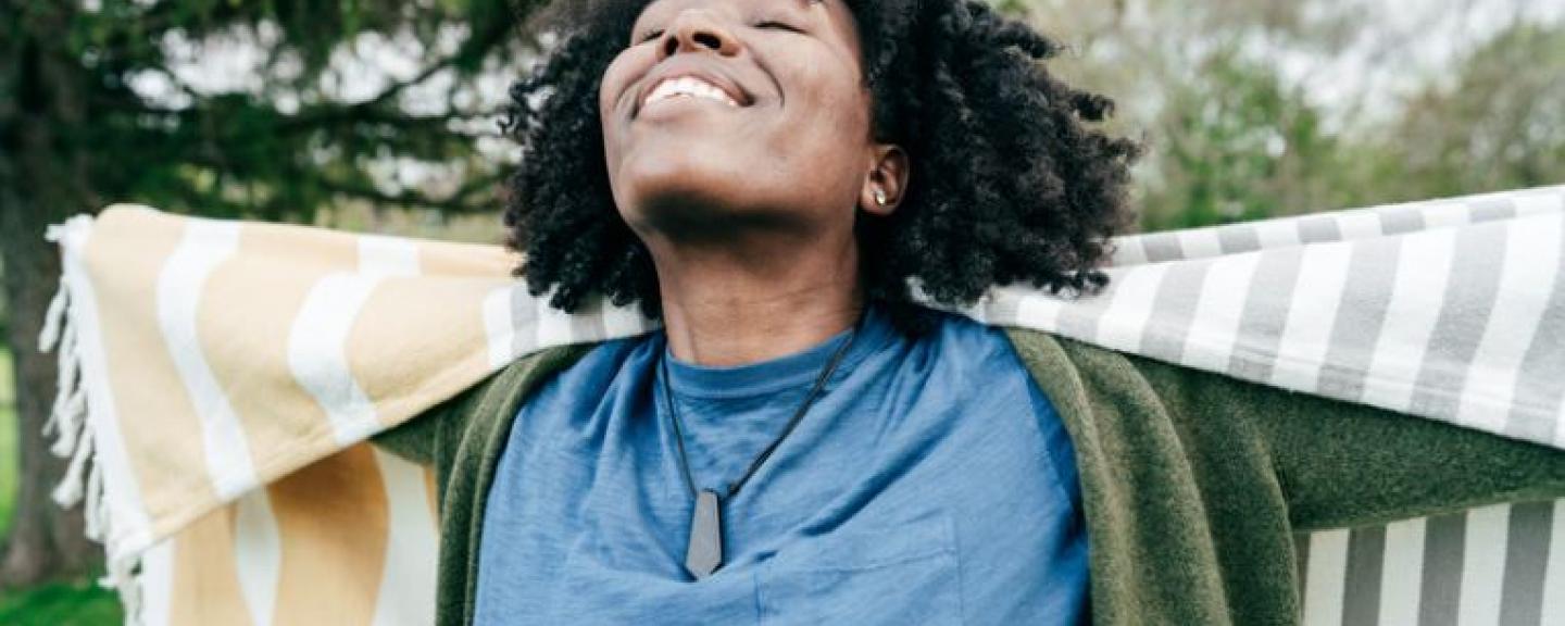 Woman smiling at the sky