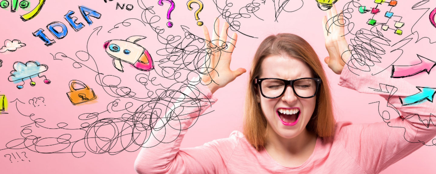 woman in anguish surrendered by doodles depicting different stressors