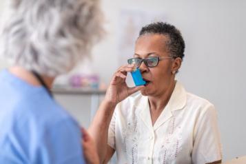 Woman using inhaler