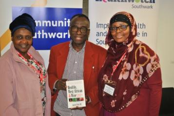 three faith group leaders in front of community southwark banner