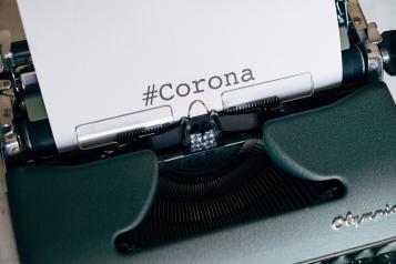 typewriter with corona on page