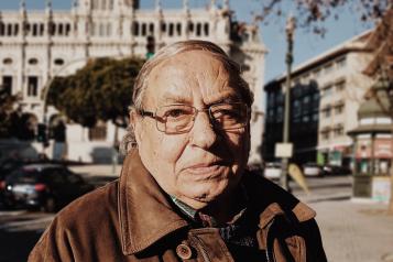 Portrait image of an older man outside