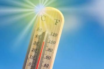 Thermometer with high temperature and sun in background