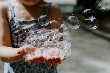 hand holding bubbles
