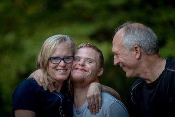 Parents and son with downs syndrome