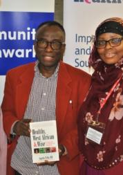 three faith group leaders in front of community southwark banner