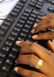 Hands typing on keyboard