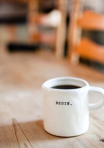 Cup of black coffee on wooden table