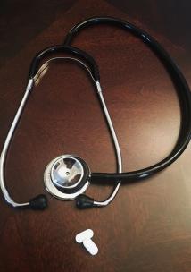 stethoscope on wooden table